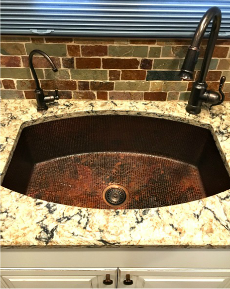 Oval copper kitchen sink installation
